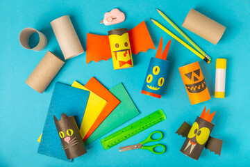 Toilet paper crafts on a colored background. Kids crafts made with toilet paper roll. DIY. Handmade. Paper toys. Origami animals. Concept of children's educational games. Place for text. Copy space.