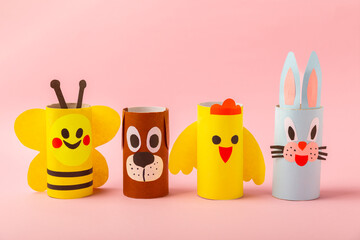 Toilet paper crafts on a colored background. Kids crafts made with toilet paper roll. DIY. Handmade. Paper toys. Origami animals. Concept of children's educational games. Place for text. Copy space.