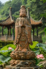 b'Buddhist Guanyin statue in the lotus pond'
