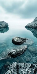 b'Rocky formations emerge from crystal clear water in shades of blue and green' - obrazy, fototapety, plakaty