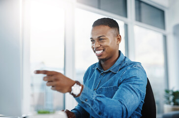 Pointing, smile and black man by computer in office, workspace and desk happy in creative career....