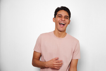 very happy young man with white background radiating youth