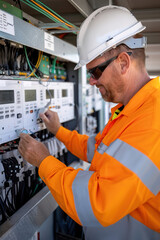 Workers installing smart meters in residential neighborhoods, efficient energy usage, modernization of the energy grid.