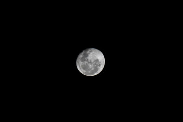 Isolated full moon on black night background