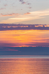 Fototapeta premium bright sky over the sea before dawn, smooth water