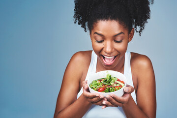 Healthy food, happy and black woman with salad, studio and balance of diet, nutrition and wellness....