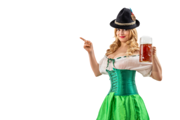 Oktoberfest girl waitress pointing finger at empty copy space. Woman in dirndl, tyrolean hat serving big beer mugs on isolated background. Traditional Bavarian, German, Austrian party, autumn festival