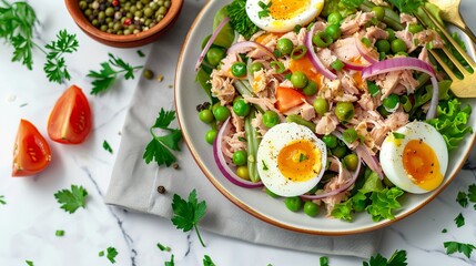 salad with canned tuna, green beans, hard-boiled eggs, red onion, tomato, lettuce