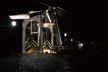 Bridge and mill at night