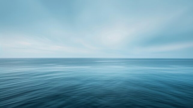 A hazy ocean horizon blends into an endless sky bringing to mind the serenity and freedom of a seaside getaway from the fastpaced modern world. .