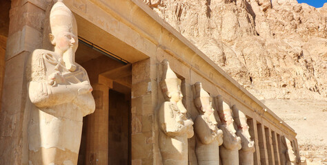 Massive statues of The Great Female Pharoah Hatshepsut with the crook and flail as ruler of Egypt...