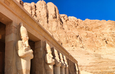 Massive statues of The Great Female Pharoah Hatshepsut with the crook and flail as ruler of Egypt...