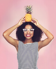 Studio, portrait and black woman with pineapple, diet and detox on pink background. Health,...