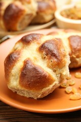 Tasty hot cross buns on table, closeup