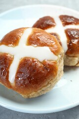Tasty hot cross buns on table, closeup