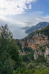Obraz premium View of the rocky landscape at hiking trail Sentiero degli Dei or Path of the Gods along the Amalfi Coast, Province of Salerno, Campania, Italy