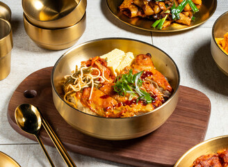 Andong Grilled Chicken Leg Bento with spoon and chopsticks served in golden dish isolated on wooden board side view of honk kong food