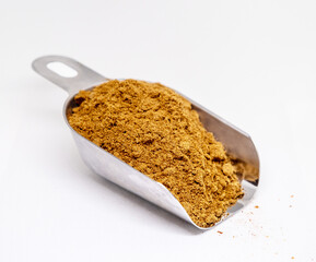 Heap of coriander powder on white background