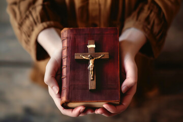 Devote Christian woman with faith holding a holy bible with a crucifix from directly above	 - Powered by Adobe