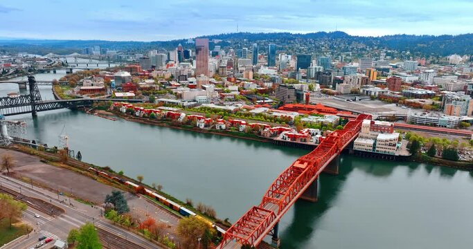 The Broadway Bridge, a bascule bridge over the Willamette River in Portland, Oregon, United States. Top view on the other bridges above the river and beautiful cityscape at sunset.