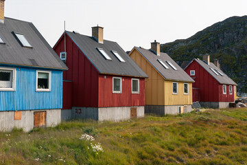 Colorful greenlandic homes closeup with grassy foreground, Ilulissat Greenland