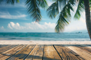 Fototapeta premium Abstract blurred background of a wooden table top with palm leaves and a blue sea in summer