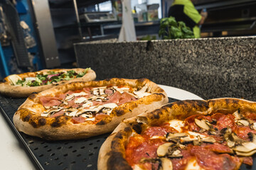 different kinds of pizza. Pizza with mushrooms and pizza with salami. Italian food. Italian restaurant. High quality photo