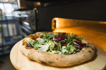freshly baked pizza, preparing italian cuisine at the restaurant kitchen. High quality photo