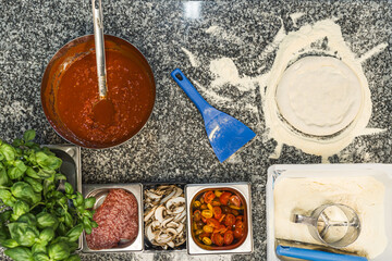 top down view of ingredients on the table t make pizza, pizza making process. High quality photo
