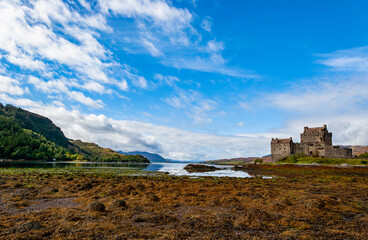 Fototapeta na wymiar Spectacularly sited reconstructed Medieval castle. Sited on an island, connected by a causeway to the mainland at the head of Loch Duich.