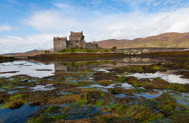 Fototapeta na wymiar Spectacularly sited reconstructed Medieval castle. Sited on an island, connected by a causeway to the mainland at the head of Loch Duich.