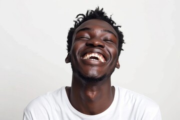 joyful young black man laughing against white background positive portrait 13