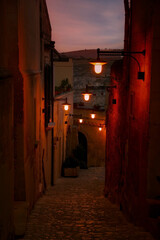 Obraz premium View from lamplit alleyway in Matera, Italy