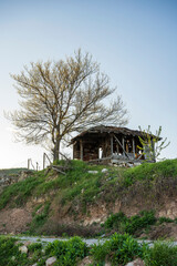 Old wooden house for keeping sheep on top of the hill.
