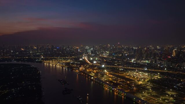 sunset time illumination bangkok riverside cityscape industrial bay port dock aerial      4k tim                     elapse thailand