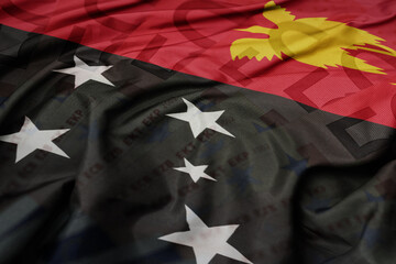 waving colorful national flag of Papua New Guinea on a euro money banknotes background. finance concept .