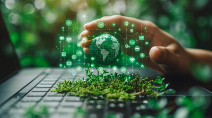 Eco-Tech and Sustainability Interface: A person points to a digital card over a laptop with icons like a globe and plant, symbolizing environmental sustainability.