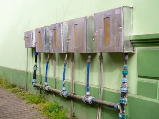 Electricity meters on the street of an Asian city. Public utilities. electricity meter.