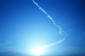 blue sky with contrails