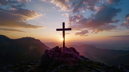 Explore the symbolic significance of a cross silhouetted against the dawn sky on a mountain peak