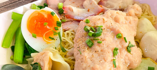 egg noodles with pork wonton soup or pork dumplings soup and vegetable