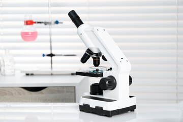 Laboratory analysis. Modern medical microscope on white table indoors