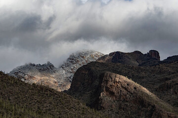 Snow on mountains with changing light