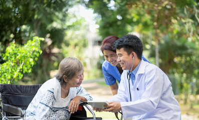 Doctor checking health of elderly woman during homecare medical.