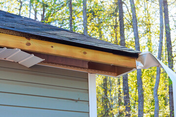 After hurricane, aluminum fascia trim was blown off, exposing exposed wood