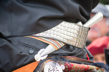 Golden Threads of Tradition: Capturing the Beauty of an Argentine Gaucho´s Ornate Belt and Facon