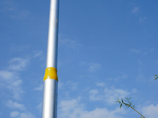 long iron pole with blue sky background