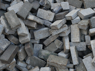 pile of paving blocks in gray color at a construction site