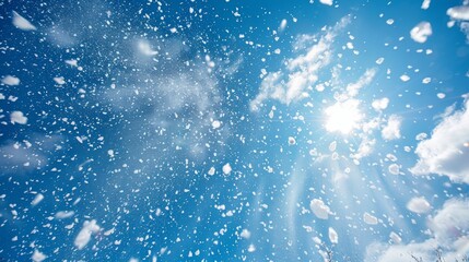 Snowflakes glistening under the sunny blue sky offering a serene winter spectacle