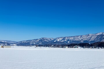 Fototapeta na wymiar 一面真っ白な長野県飯山の山並み